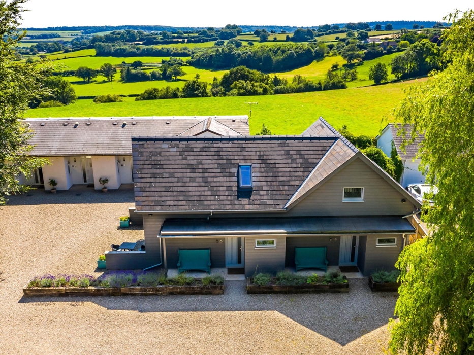 Drone shot of Rock Lodge with rolling countryside beyond