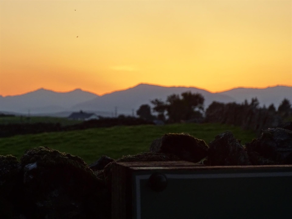 An amazing sun set over Eryri (Snowdonia) National Park taken from the grounds of Llwyn Onn Guest House.
