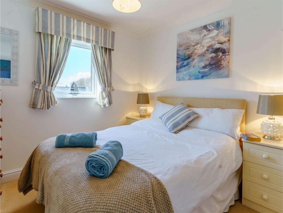 Our double bedroom, with side tables and a chest of drawers, and a single wardrobe out of view.  Sits at the back of the house.