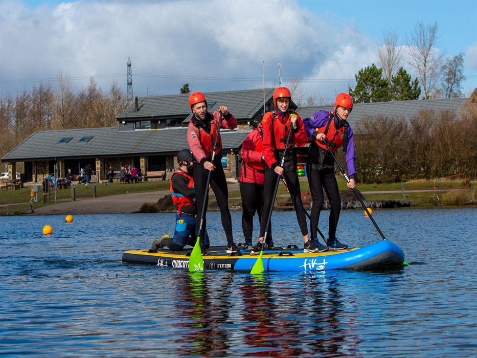Groups of people can take to the water as a team on our tiki boards.