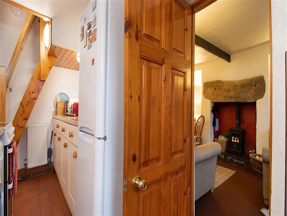 View from kitchen showing living room and stairs