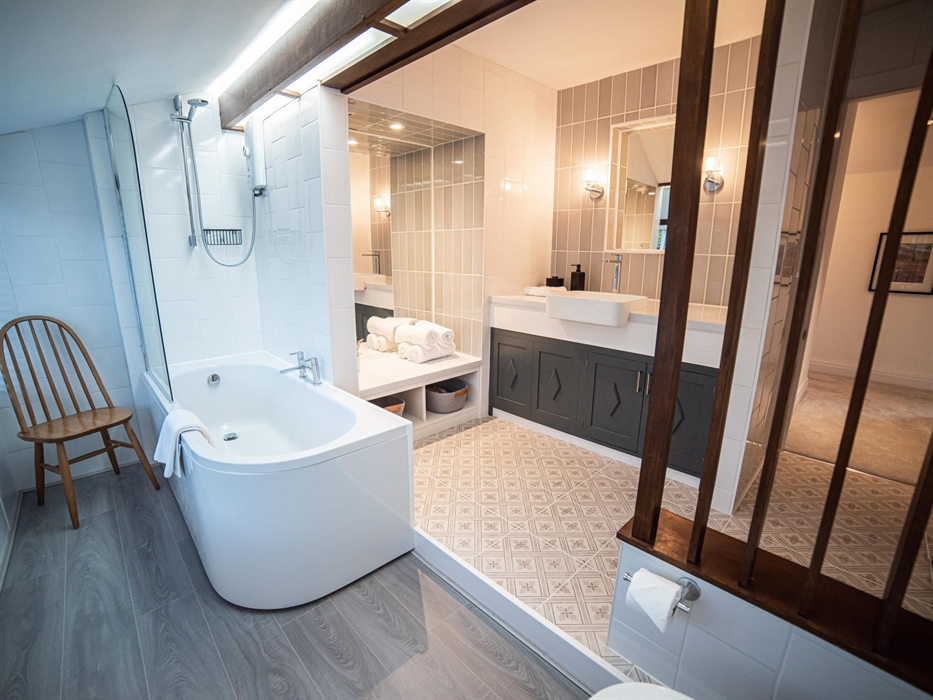 Enjoy the convenience and elegance of a spacious family bathroom upstairs, alongside a separate toilet and washroom on the ground floor.