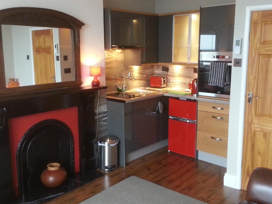 Living room incorporating kitchenette