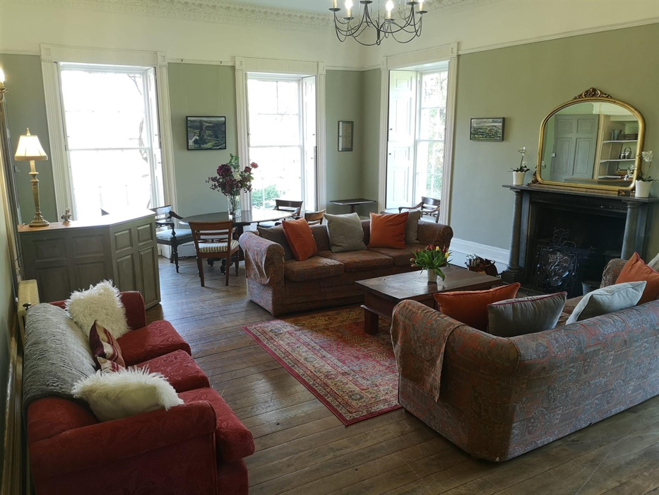 Our spacious Drawing Room has its own bar that you can stock with whatever you may wish, an open coal fire and comfy sofas to sit back and relax on. T
