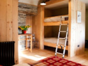 Calon - a family room with king bed & bunks