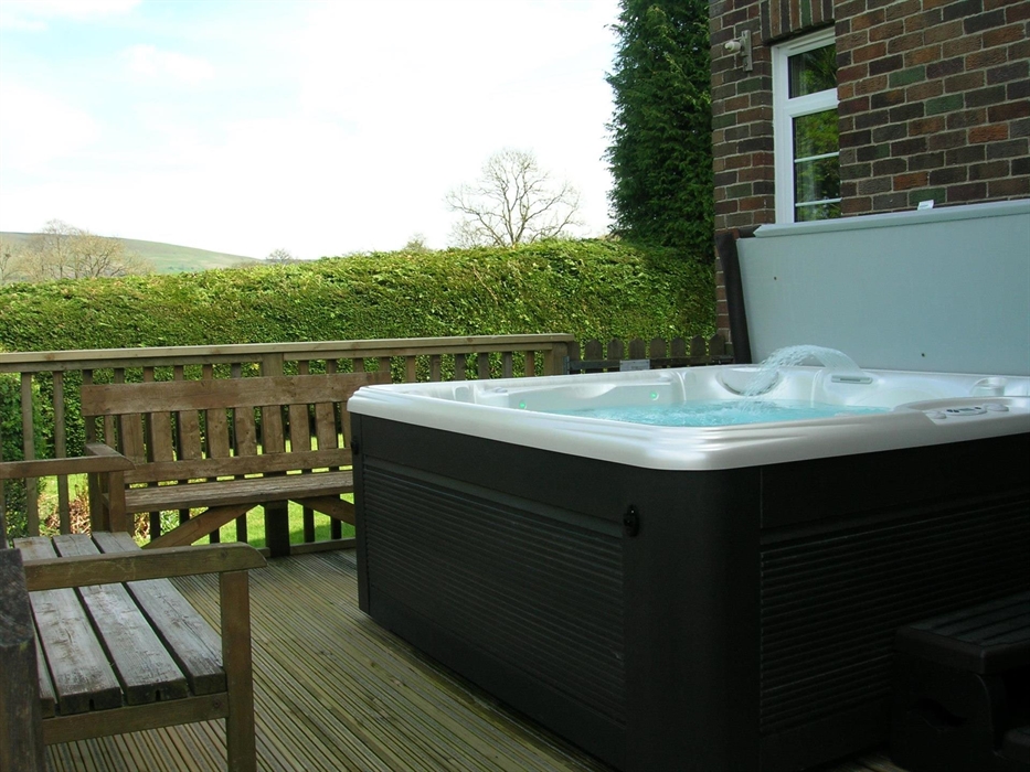 New decking area with new hot tub just outside the back door.