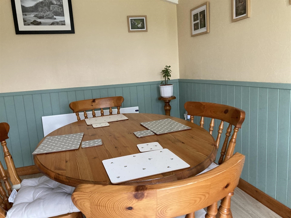 Newly-decorated, the dining room opens out onto the private patio with views of the garden and the valley