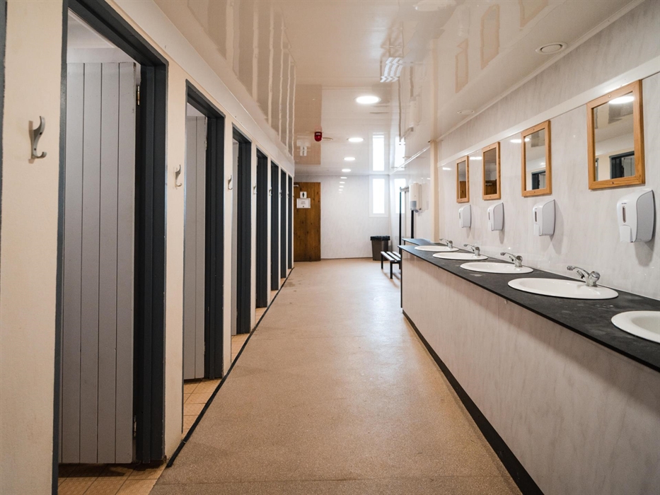 We have several dedicated shower and toilet blocks supporting all buildings and our campsites.  These separate male and female facilities are serviced