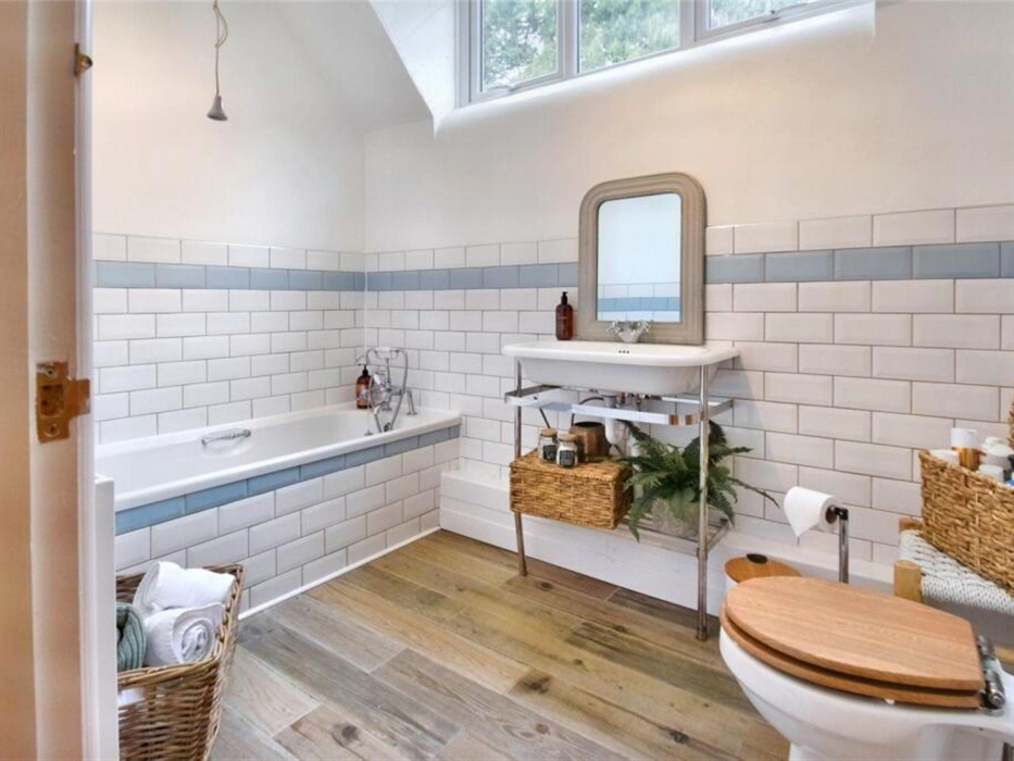 The family bathroom is located between the two bedrooms on the first floor. The Master bedroom has an additional feature bathtub with a cloakroom bein