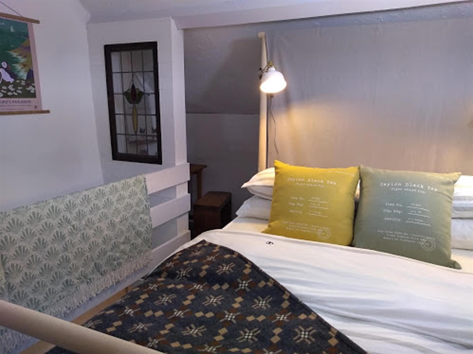 The cozy mezzanine double bedroom in Farmhand.