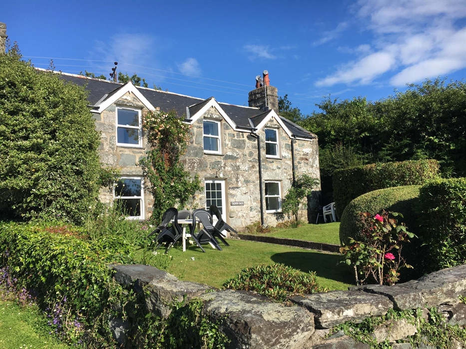 Talwrn Bach Farmhouse, a 400 year old stone building set in a walled garden