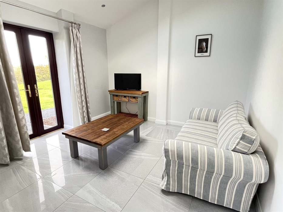 Spacious living room with flat screen TV and WiFi thoughout.