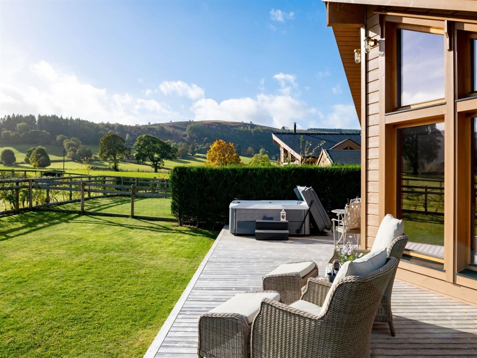 A decked area with your own enclosed garden and luxury hot tub.