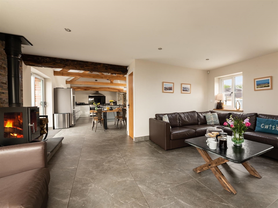 Corner sofa, Smart TV, log burner with sea vie