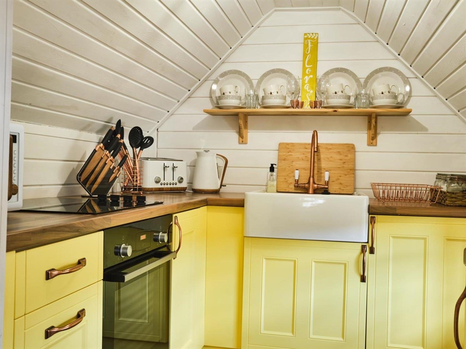 Kitchen has oven and hob, fridge and microwave for your convienience.