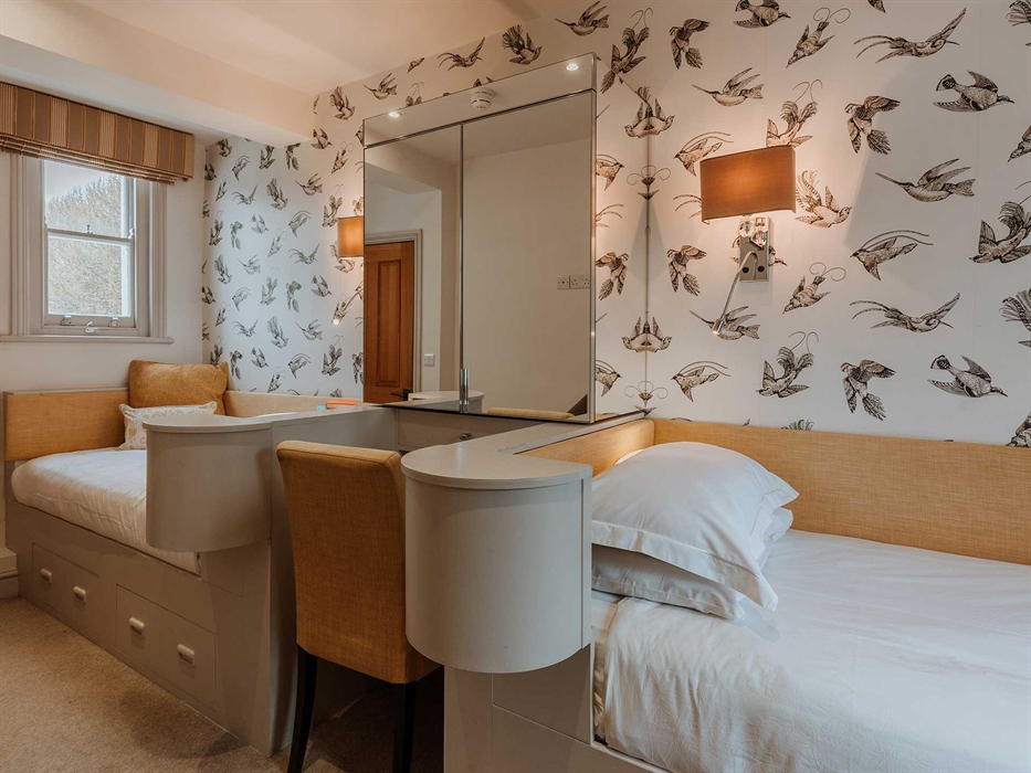 Bedroom Ten is a twin room on the first floor with views of both the courtyard and the lime avenue.