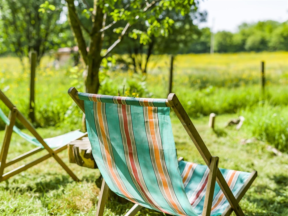 Deckchairs down by the river at  Erwain Escapes. Wonderful setting to relax with a book and a cuppa - Luxury Glamping Cabins with Hot Tubs - Brecon Be