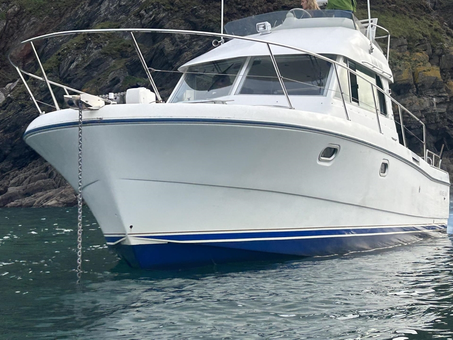 The Shee Ann, a Beneteau Antares 10.80, is a versatile vessel used for RYA motor cruising courses, Channel swimming piloting, and Gower Coast sightsee