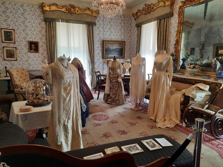 Display of period costumes in the drawing room at Scolton Manor