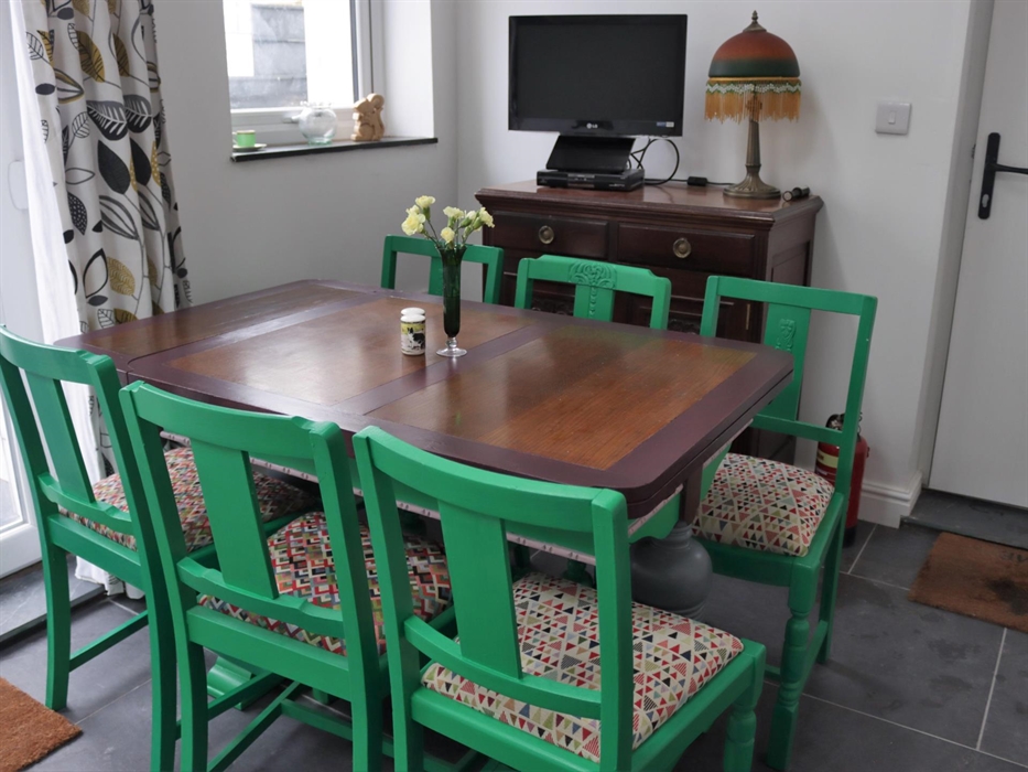 Rear entrance from Parking area.  French Doors to Patio with steps up to garden.
More gentle steps to garden from side of cottage from front door. Ta