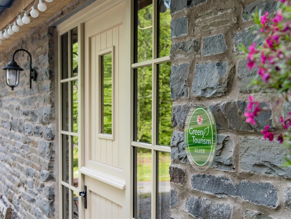 Front of Drovers Retreat with Green Tourism Plaque