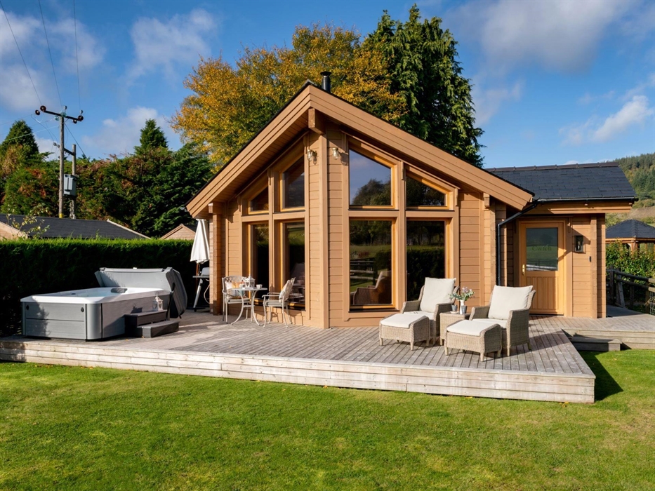 An enclosed garden with private decking and hot tub