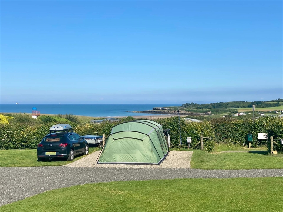 Stunning all-weather serviced pitches suitable for tents, touring caravans and motorhomes