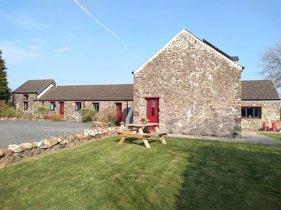 Communal garden set up with picnic tables.
