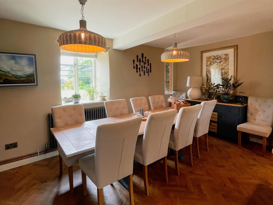 The breakfast table that seats ten in the kitchen at Ysgubor Degwm.