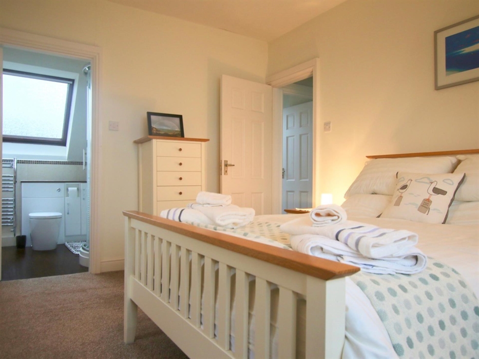 Master bedroom has en -suite shower room and sea views form it's comfy window seat