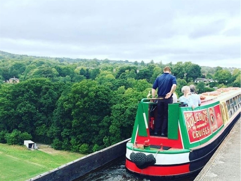 In this scene, Llangollen Wharf's Motorised Canal Boat Thomas Telford is crossing the Poncysyllte Aqueduct and passengers are taking in the stunning v