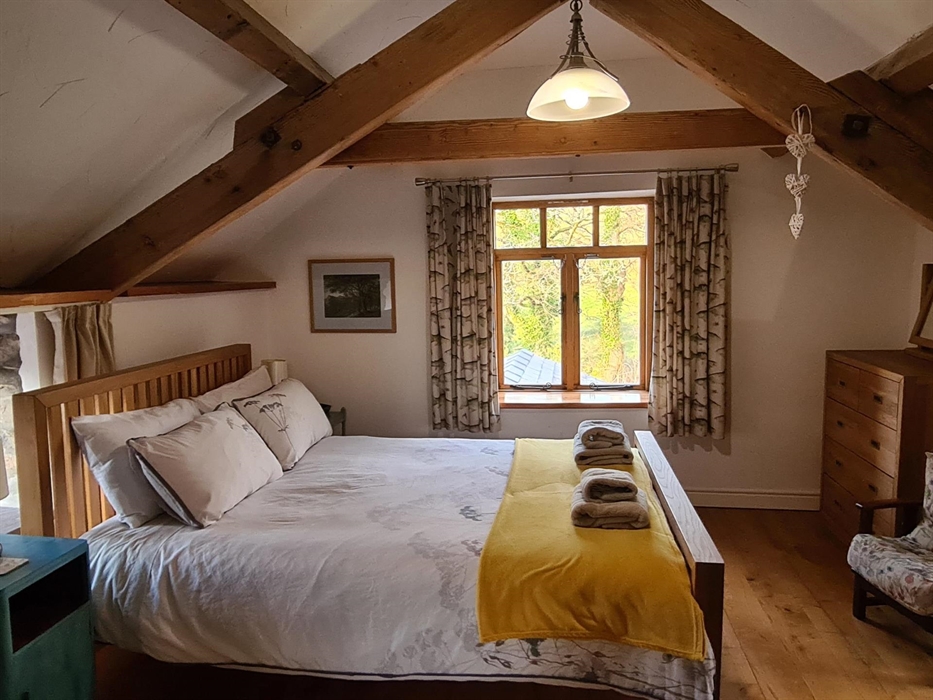 The master bedroom has a comfortable king size bed