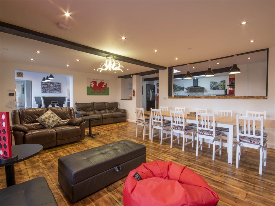 Welsh Row House with large living room and dining area.  Open plan area to Games room and kitchen.  Plenty of seating for all guests.