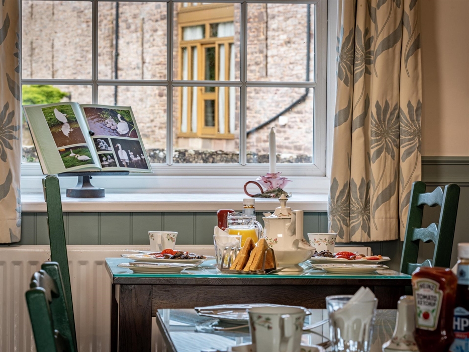 Tasty breakfast with great views from our breakfast room, including locally made sausages and thick bacon.