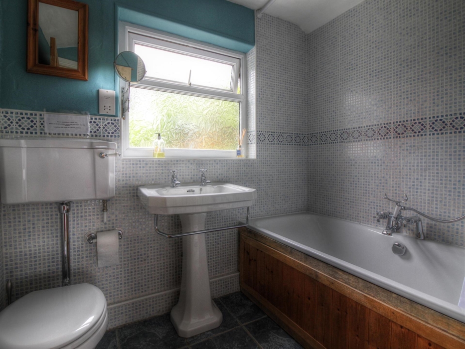 Main family bathroom with over bath shower