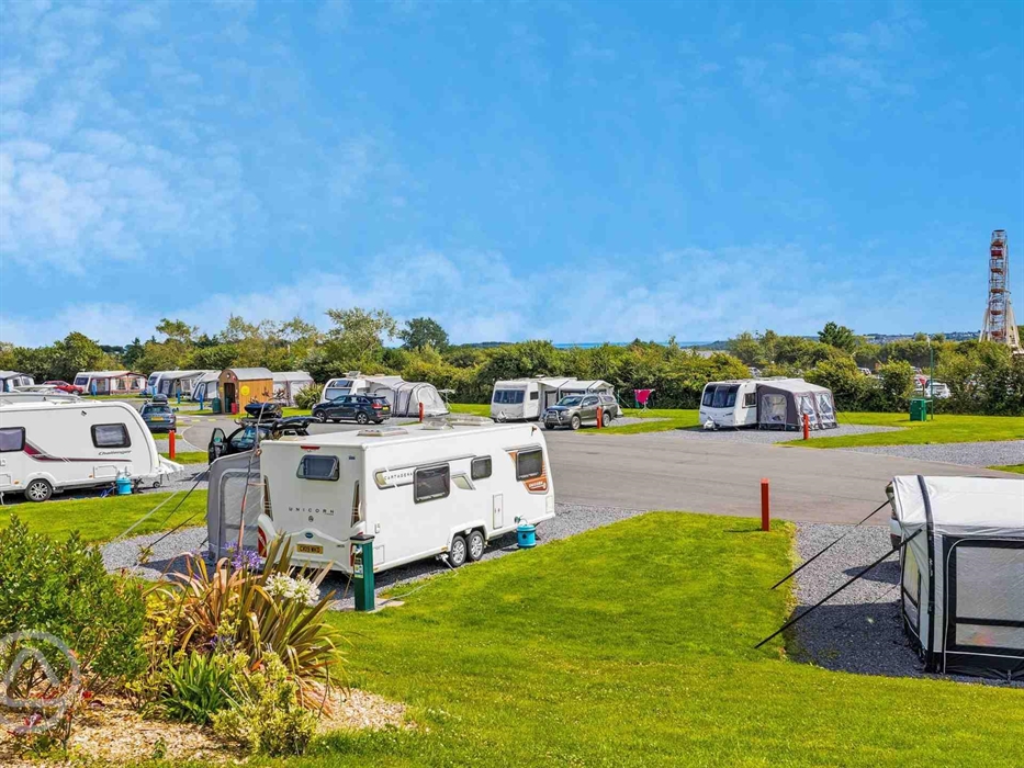 Super-sized touring pitches with views of the Big Wheel