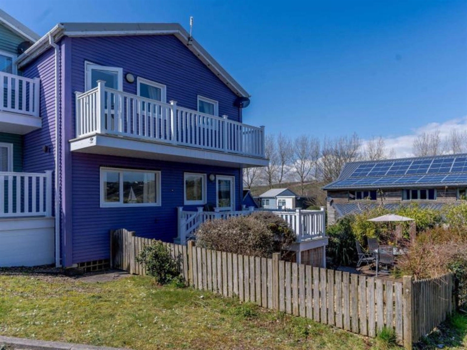View of the house showing the front garden and the lower and upper decks.