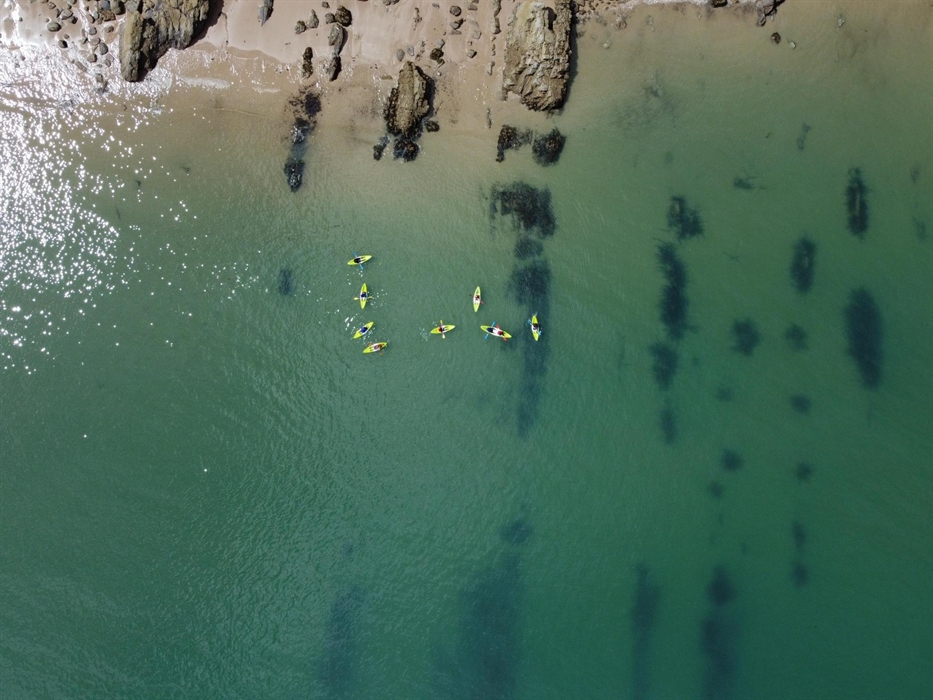Kayaking the clear water near Tenby
