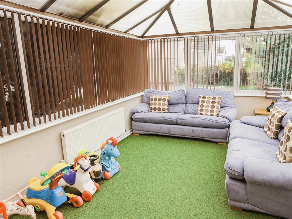 Conservatory leading to outdoor secure play area