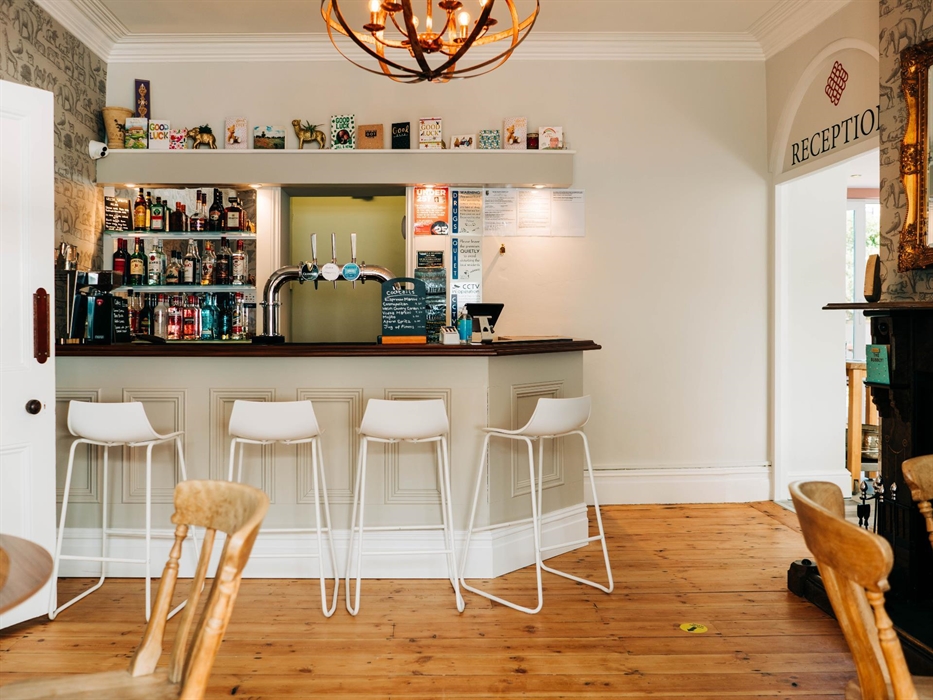 B&B Corner bar area with white stools