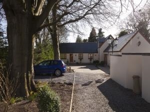 A front image of the Mews and parking area
