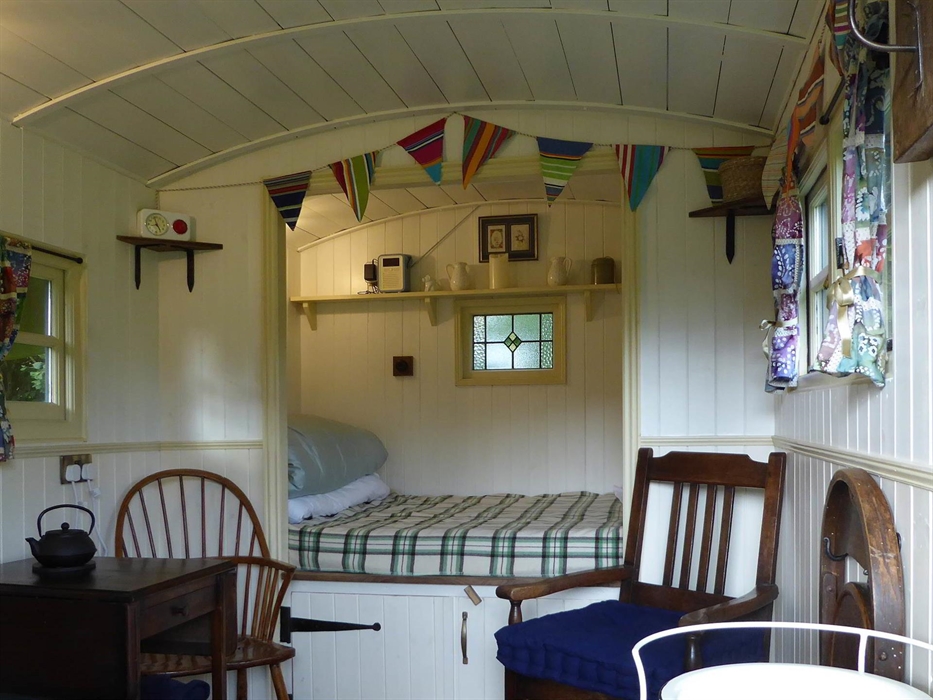 Bed and Chairs inside the Hygge Hut