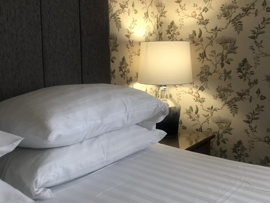 This room is a large king size room with a bay window. It boasts a shower room with rainfall shower