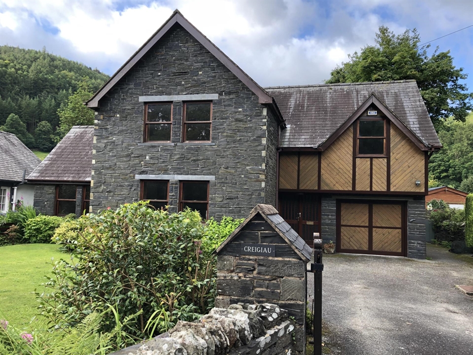 Stone and wood cladding 2 storey house