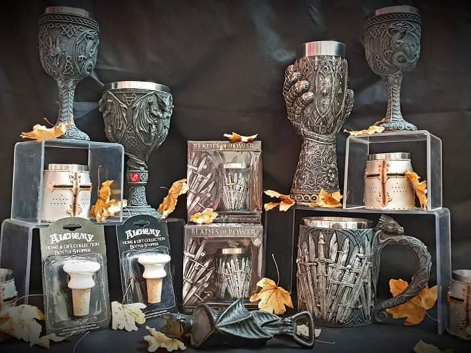 Goblets and shot glasses, dragon bottle stop and a bat bottle opener available at King Arthur's Labyrinth Gift Shop.