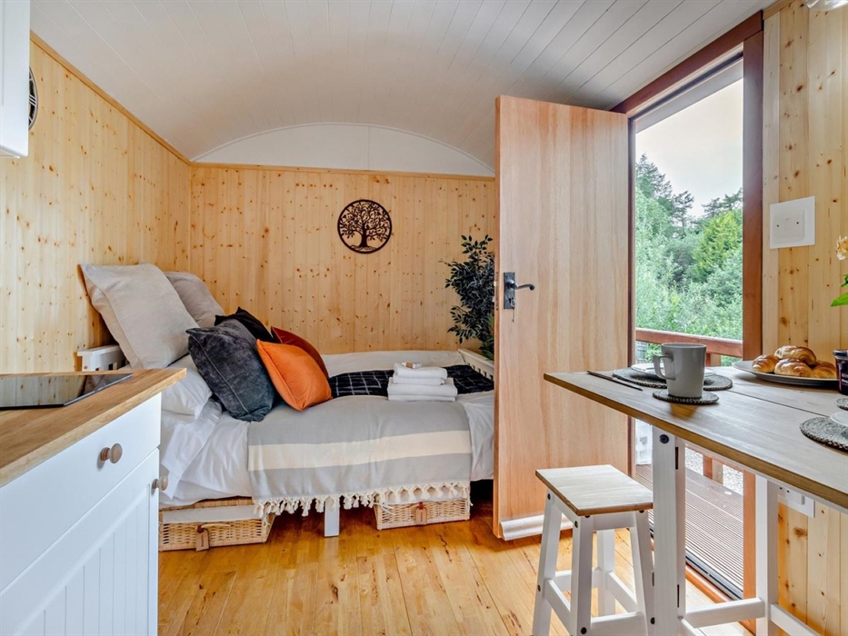 Open the door and be immersed in nature and stunning scenery.
Living area with wood burning stove