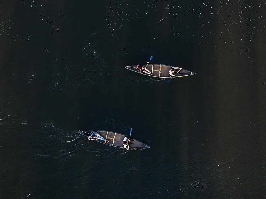 Two canoeists paddling the River Wye, photo taken from above.