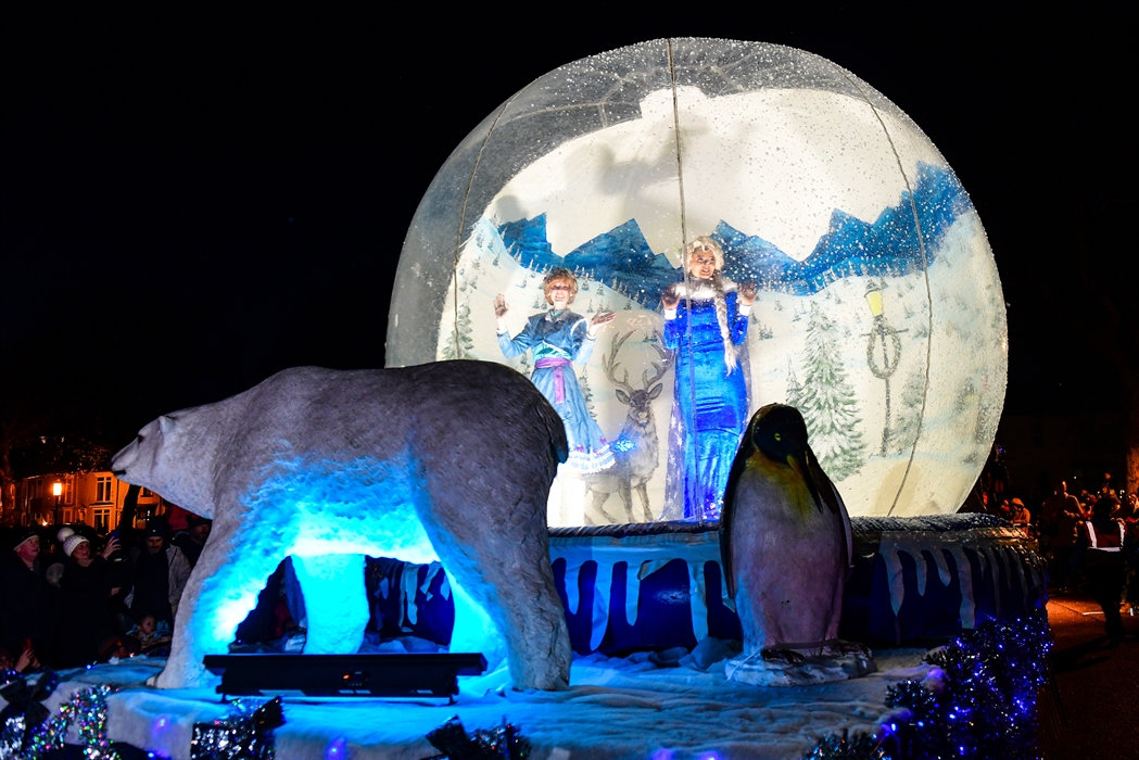 Favourite characters in a snow globe with a giant polar bear and penguin, taking part in the Swansea Christmas Parade