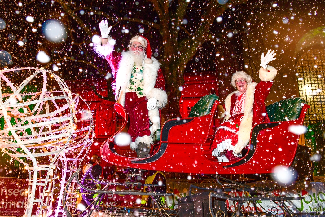 Santa and Mrs Claus on their sleigh, taking part in the Swansea Christmas Parade