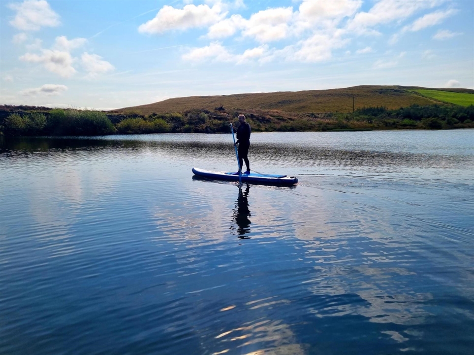 A unique experience learning to paddle board in a sheltered lake deep in the Cambrian mountains